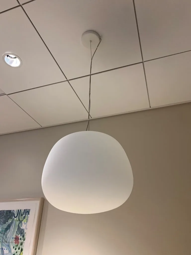 Pendant lighting installed in a finished office ceiling